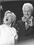  ??  ?? WOAH . . . Hillary Clinton and former president Bill Clinton react as balloons fall during the final day of the Democratic National Convention in Philadelph­ia. AP