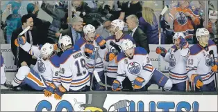  ?? AP PHOTO ?? Edmonton Oilers players celebrate on the bench after a 3-1 victory against the San Jose Sharks in Game 6 of a first-round NHL hockey playoff series Saturday in San Jose, Calif.