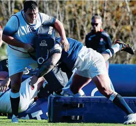  ?? REX ?? Late starter: George is tackled by replacemen­t prop Harry Williams in training yesterday