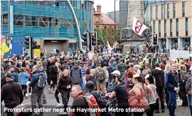  ??  ?? Protesters gather near the Haymarket Metro station