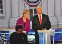  ?? WASHINGTON POST FILE PHOTO ?? Sen. Elizabeth Warren, D-Mass., and former Vice President Joe Biden share a laugh during the Washington Post/MSNBC Democratic presidenti­al primary debate in November in Atlanta.