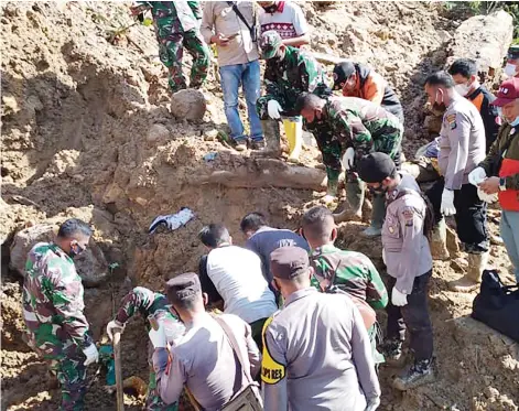  ?? — AFP photo ?? Rescuers searching for survivors after a rain-sparked landslide killed at least three people near a power plant in Batang Toru in South Tapanuli, North Sumatra.