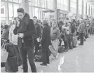  ?? ERIK S. LESSER/EPA-EFE ?? A power outage at Atlanta’s Hartsfield-Jackson Airport left passengers scrambling to find answers and options as holiday travel ramps up.