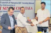  ?? SOURCED ?? Deputy CM Dushyant Chautala (right) launched the GST Scrutiny Manual in Gurugram on Tuesday.