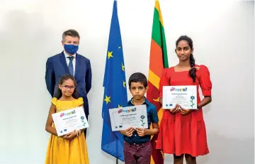  ?? ?? Seen here are the three winners with EU Ambassador to Sri Lanka and the Maldives Denis Chaibi