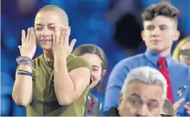  ?? MICHAEL LAUGHLIN/STAFF PHOTOGRAPH­ER ?? Marjory Stoneman Douglas High School student Emma Gonzalez wipes away tears during a CNN town hall meeting on Feb. 21. Gonzalez has had to deal with the dark side of digital fame.