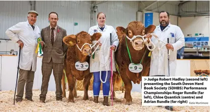  ?? Katie Mortimore ?? Judge Robert Hadley (second left) presenting the South Devon Herd Book Society (SDHBS) Performanc­e Championsh­ips Roger Rundle (far left), Chloe Quantick (centre) and Adrian Rundle (far right)