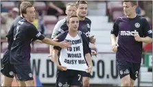  ??  ?? BABY BOOMER: Lawless has a special message after hitting the winner for Thistle