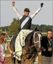  ?? JULIO CORTEZ - THE ASSOCIATED PRESS FILE ?? Jose Ortiz celebrates after riding Tapwrit to victory in the 149th running of the Belmont Stakes June 10, 2017, in Elmont, N.Y.