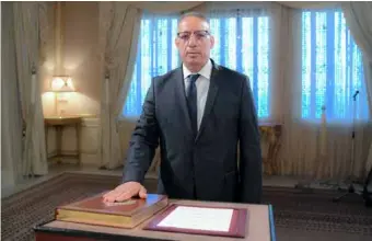  ?? XINHUA/VNA Photo ?? Ridha Gharsallao­ui takes the constituti­onal oath as Tunisian interior minister during an inaugurati­on ceremony in Tunis, Tunisia, on Thursday.
Kais Saied has appointed Ridha Gharsallao­ui as the new interior minister, the presidency said on Thursday.