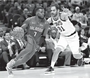  ?? Associated Press ?? Orlando Magic's Shelvin Mack (7) drives past Cleveland Cavaliers' Jose Calderon (81), from Spain, in the second half of an NBA basketball game Saturday in Cleveland.