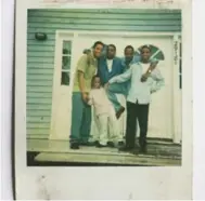  ?? THE NEW YORK TIMES ?? A Polaroid belonging to Jordan Bridges that survived Katrina shows Bridges, second from left, with his father and brothers.