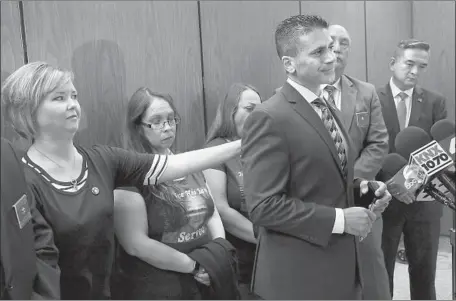  ?? Al Seib Los Angeles Times ?? JENNIFER GARCIA, Gabriel Fernandez’s teacher who repeatedly reported signs of abuse, comforts prosecutor Jonathan Hatami after the boy’s mother and her boyfriend were sentenced Thursday for his murder. “They are evil,” Garcia said. “I know who’s truly...