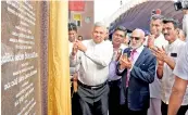  ??  ?? Prime Minister Ranil Wickremesi­nghe unveils the plaque erected at ‘Lakhiru Sevana’ low income housing scheme. Minister of Megapolis Patali Champika Ranawaka and MPS A . H. M. Fowzie and Mujibur Rahman are also present. PIC BY PRADEEP PATHIRANA