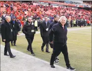  ?? Charlie Neibergall / Associated Press ?? In this Jan. 20 photo, New England Patriots owner Robert Kraft, right, arrives on the field before the AFC Championsh­ip game against the Kansas City Chiefs, in Kansas City. Kraft visited a Florida massage parlor for sex acts on the morning of the AFC Championsh­ip Game, which he attended in Kansas City later that day.