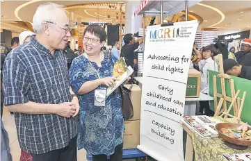  ??  ?? Minister in the Prime Minister’s Department Datuk Paul Low (left) visiting a booth after launching the Human Rights Festival at Sunway Velocity Mall in Kuala Lumpur. — Bernama photo