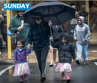  ?? KEVIN STENT/STUFF ?? Kararaina Te Ahuru, left, was going to celebrate her 4th birthday with her sister Te Rongopai, 5, and her mum Keta at the Very Welly Christmas which was cancelled due to bad weather yesterday.