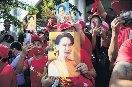  ?? PHOTO: GETTY IMAGES ?? The face of protest . . . People hold up images of Myanmar’s de facto leader Aung San Suu Kyi at a protest outside Myanmar’s embassy in Bangkok, Thailand.