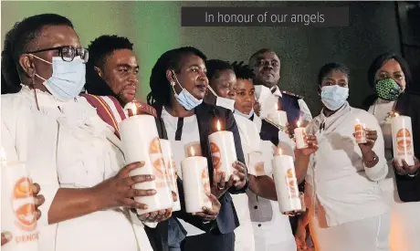  ??  ?? NURSES with Candles of Light to commemorat­e Internatio­nal Nurses Day at the CSIR ICC in Tshwane yesterday.
| JACQUES NAUDE African News Agency (ANA)