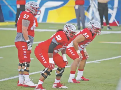  ?? PHOTOS COURTESY UNM ?? University of New Mexico offensive lineman Teton Saltes, center, anchored the front line for the Lobo football team for the last four years. A senior, he is a finalist for the Wuerffel Trophy, which recognizes the nation’s top college football player for community service and academic success.