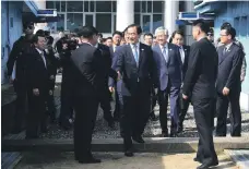 ?? Yonhap via AP ?? South Korean Unificatio­n Minister Cho Myoung-gyon crosses to North Korea in Panmunjom yesterday