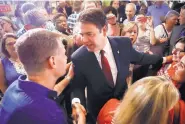  ?? JOHN MINCHILLO/ASSOCIATED PRESS ?? Danny O’Connor, the Franklin County recorder, shakes hands with supporters on election night.