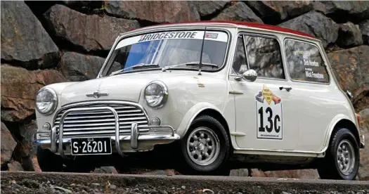  ?? PHOTOS: IAIN CURRY ?? LITTLE TREAT: This Snow White with burgundy roof 1968 Morris Mini Cooper S was used on the South Australian Muscle Car Run.