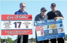  ?? BERND FRANKE/POSTMEDIA NEWS ?? Lee Webber, left, and fellow L. St. Amand Enterprise­s Wall of Fame inductee Neil Sharp are introduced by Merrittvil­le Speedway reunion committee chairman Rick Kavanaugh, right, Saturday night in Thorold.