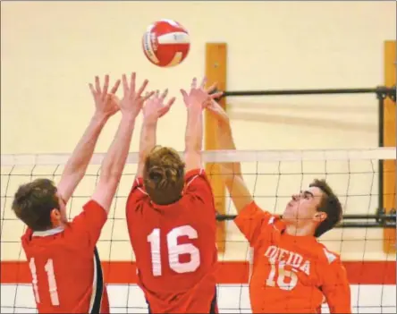  ?? JOHN BREWER - ONEIDA DAILY DISPATCH ?? Vernon-Verona-Sherrill’s Kyle Greene (11) and Owen Rose (16) attempt to block a Noah Savage shot during Tuesday’s Section III Class B semifinal boys volleyball contest.