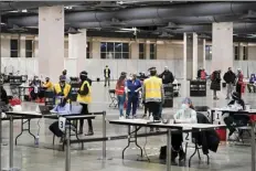  ?? AP file photo ?? COVID-19 vaccinatio­n site is set up at the Pennsylvan­ia Convention Center in Philadelph­ia on Feb. 3. The clinic opened to help provide second doses of the vaccine.