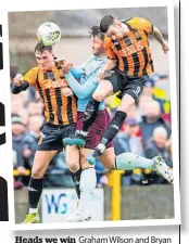  ?? ?? Heads we win Graham Wilson and Bryan Boylan challenge Hearts’Craig Halkett