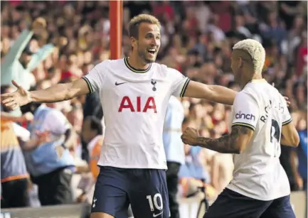  ?? (Photo: AFP) ?? Tottenham Hotspur striker Harry Kane (left) celebrates with teammate Richarliso­n after scoring their second goal during the English Premier League football match versus Nottingham Forest at The City Ground in Nottingham, central England, on Sunday, August 28, 2022.