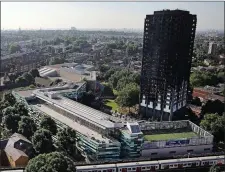  ??  ?? The charred ruins of the Grenfell tower block in London.