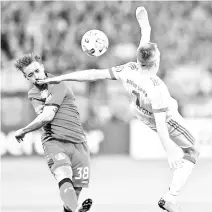  ??  ?? Leverkusen’s German midfielder Karim Bellarabi (L) and Bayern Munich’s French midfielder Franck Ribery vie for the ball during the German football Cup DFB Pokal semifinal match Bayer 04 Leverkusen vs Bayern Munich in Leverkusen, western Germany, on...