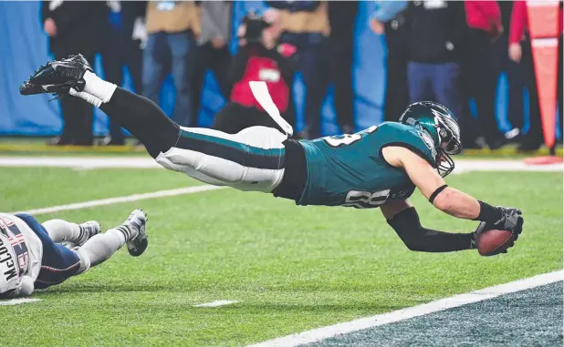  ?? Picture: AFP PHOTO ?? FLYING: Zach Ertz of the Philadelph­ia Eagles dives for a touchdown during Super Bowl LII against the New England Patriots in Minnesota.