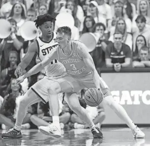  ?? KIRTHMON F. DOZIER/DETROIT FREE PRESS ?? Michigan State guard A.J. Hoggard (11) defends against Tennessee guard Dalton Knecht (3) at Breslin Center in East Lansing on Sunday.