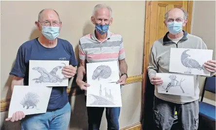  ?? ?? From left are: FOBNR chairperso­n Peter West, artist Vic Grobbler and photograph­er Roger O’Neil, who digitised the sketches for the calendar, all hold up a selection of Grobbler’s sketches included in the 2022 calendar to raise funds for FOBNR.