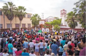  ?? REBECCA BLACKWELL/ASSOCIATED PRESS ?? Bishop Oscar Campos Contreras leads an open air Mass on Sunday outside St. Vicente Ferrer church, which was heavily damaged in Thursday’s quake, in Juchitan, Mexico.