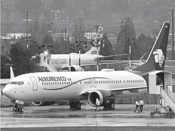  ?? TED S. WARREN/AP ?? Workers prepare a Boeing 737 Max 9 for a flightWedn­esday fromRenton Municipal Airport inWashingt­on state.