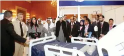  ??  ?? Health ministry officials listen to a demonstrat­ion at the Central Circle Company’s booth.