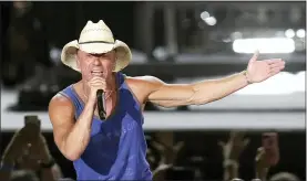  ??  ?? Kenny Chesney performs during the Trip Around the Sun Tour in Phoenix in 2018.