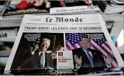  ?? FRANCOIS MORI/ASSOCIATED PRESS ?? The French newspaper Le Monde carries the front-page headline “Trump-Biden: the United States is tearing itself apart” above an editorial about the U.S. presidenti­al election Wednesday.
