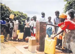  ?? CONTRIBUTE­D ?? After a well is constructe­d, people living in areas of Africa and Haiti have access to clean, safe water. Because it’s close to their community, they don’t have to carry the heavy loads for long distances.