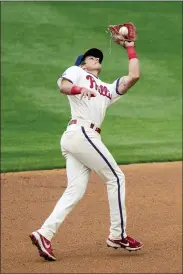  ?? CHRIS SZAGOLA - THE ASSOCIATED PRESS ?? Philadelph­ia Phillies shortstop Nick Maton catches a fly ball during the fourth inning Wednesday in Philadelph­ia.