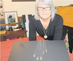  ?? Photo/ Alyssa Smith ?? Sally Johnson with some of her pendants.