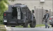  ?? SCOTT GARDNER, THE HAMILTON SPECTATOR ?? Members of the Hamilton Police Service’s Emergency Response Unit respond to a call in June. The Hamilton Police Associatio­n has been asking the service to provide high-powered rifles to more front-line officers.