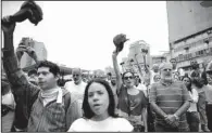  ?? AP/ARIANA CUBILLOS ?? Silent marchers fill the streets Saturday in Caracas, Venezuela, to honor the people killed in recent unrest.