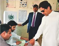  ?? Online ?? Prime Minister Imran Khan gets his thumb inked before casting his vote for by-election in NA-53 Bani Gala.