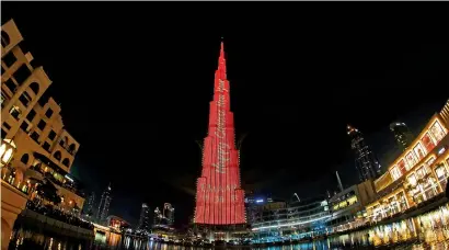  ?? Photo by Shihab ?? A laser show on the Burj Khalifa displays a Happy New Year message as part of the Chinese New Year. —