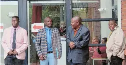  ?? Picture: TEMBILE SGQOLANA ?? UNEXPECTED SITUATION: Enoch Mgijima LFA delegates stand outside the department of sport, recreation, arts and culture building on Sunday, after being chased out of the Safa Chris Hani regional congress.